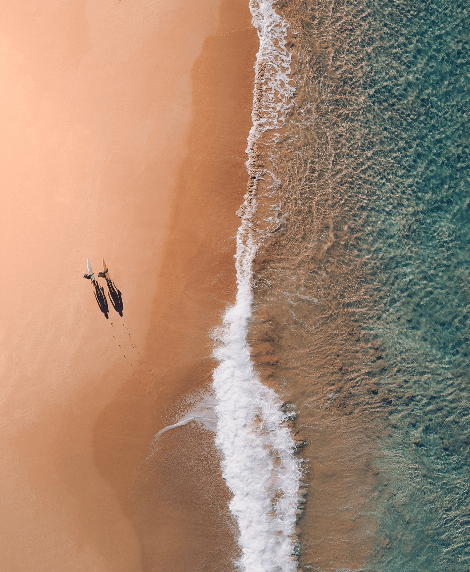 Aerial view of a remote coastline with turquoise water